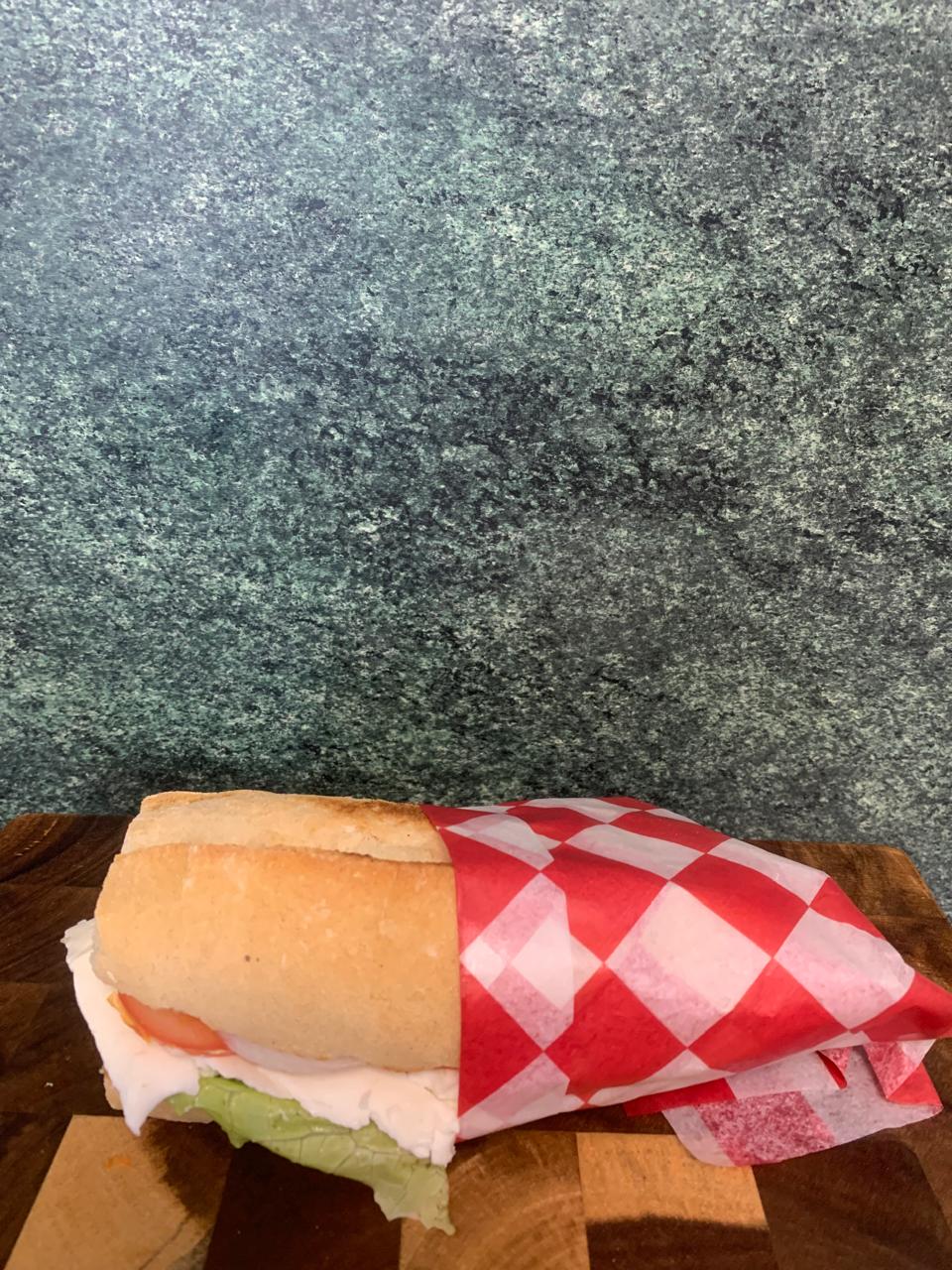 Fresh Turkey Sandwich Wrapped In Checkered Paper